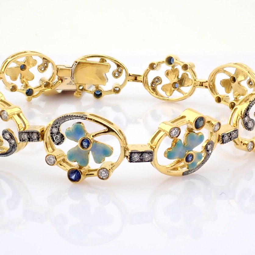 Natural Diamond 18K Yellow Gold Bracelet: Title: Natural Diamond 18K Yellow Gold Bracelet Description: 18K yellow gold bracelet detailed with emerald, sapphire and brilliant diamonds --------------------------------------------------