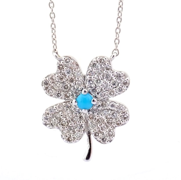 Natural Diamond 18K White Gold Necklace: Title: Natural Diamond 18K White Gold Necklace Description: An exquisite 18k white gold clover necklace detailed with turquoise and brilliant diamonds