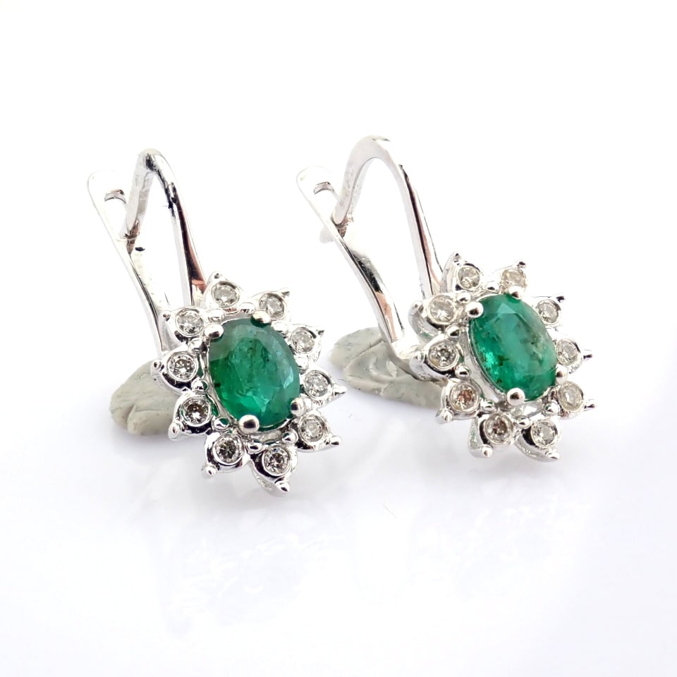 Natural Diamond 18K White Gold Earring: Title: Natural Diamond 18K White Gold Earring Description: 18K white gold cluster earring detailed with emerald and brilliant diamonds -------------------------------------------------- •