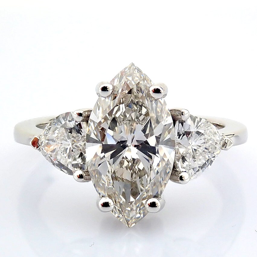Marquise Cut Lab-Grown Diamond Ring - 3.36 Total Carat (IGI Certified): Title: Marquise Cut Lab-Grown Diamond Ring - 3.36 Total Carat (IGI Certified) Description: -------------------------------------------------- METALS AND WEIGHTS : -14K White Gold 3.35 gr