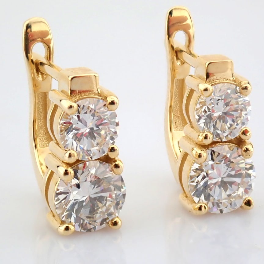 Round Cut Lab-Grown Diamond Earring - 2.5 Total Carat (MDI Certified): Title: Round Cut Lab-Grown Diamond Earring - 2.5 Total Carat (MDI Certified) Description: -------------------------------------------------- METALS AND WEIGHTS : -14K Yellow Gold 4.43