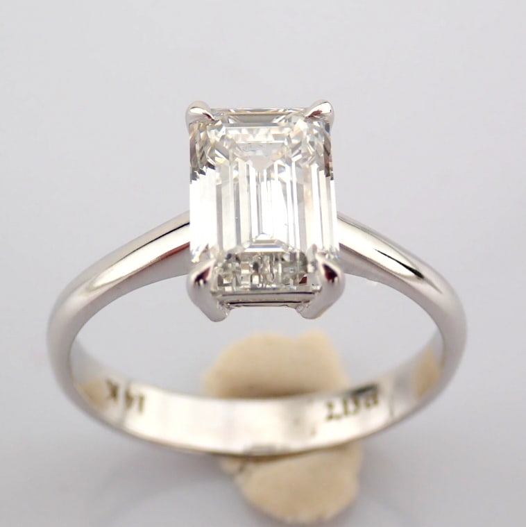 Emerald Cut Lab-Grown Diamond Ring - 2.13 Total Carat (IGI Certified): Title: Emerald Cut Lab-Grown Diamond Ring - 2.13 Total Carat (IGI Certified) Description: -------------------------------------------------- METALS AND WEIGHTS : -14K White Gold 2.86 g