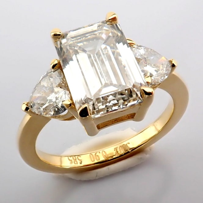 Emerald Cut Lab-Grown Diamond Ring - 3.92 Total Carat (IGI Certified): Title: Emerald Cut Lab-Grown Diamond Ring - 3.92 Total Carat (IGI Certified) Description: -------------------------------------------------- METALS AND WEIGHTS : -14K Yellow Gold 3.93 gr