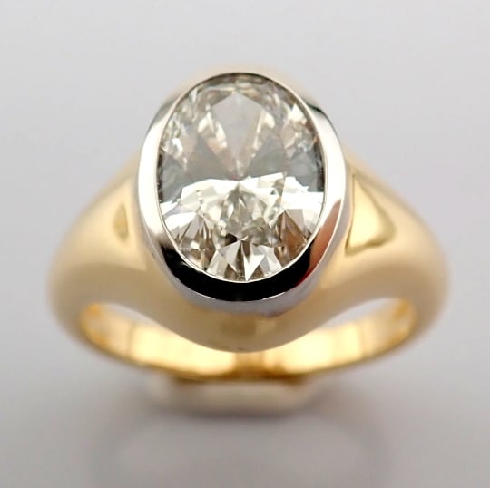 Oval Cut Lab-Grown Diamond Ring - 2.05 Total Carat (IGI Certified): Title: Oval Cut Lab-Grown Diamond Ring - 2.05 Total Carat (IGI Certified) Description: -------------------------------------------------- METALS AND WEIGHTS : -14K Yellow/White Gold 6.81 gr