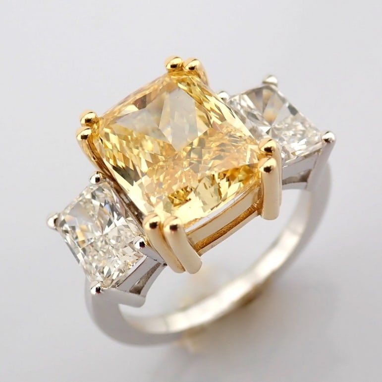 Cushion Cut Lab-Grown Diamond Ring - 6.95 Total Carat (IGI Certified): Title: Cushion Cut Lab-Grown Diamond Ring - 6.95 Total Carat (IGI Certified) Description: -------------------------------------------------- METALS AND WEIGHTS : -14K Yellow/White Gold 4.85 gr