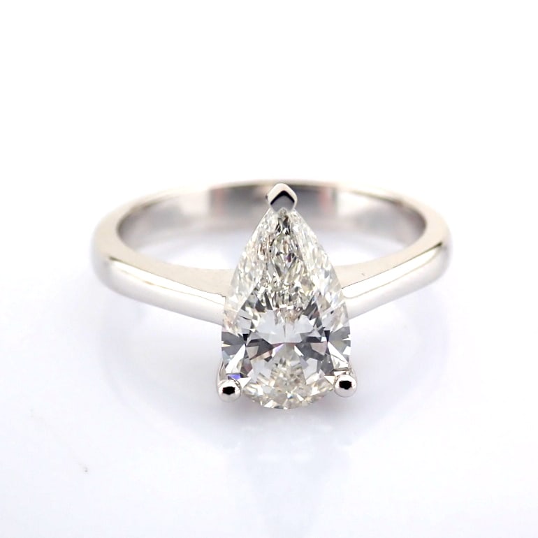 Pear Cut Lab-Grown Diamond Ring - 1.35 Total Carat (IGI Certified): Title: Pear Cut Lab-Grown Diamond Ring - 1.35 Total Carat (IGI Certified) Description: -------------------------------------------------- METALS AND WEIGHTS : -14K White Gold 3.53 gr