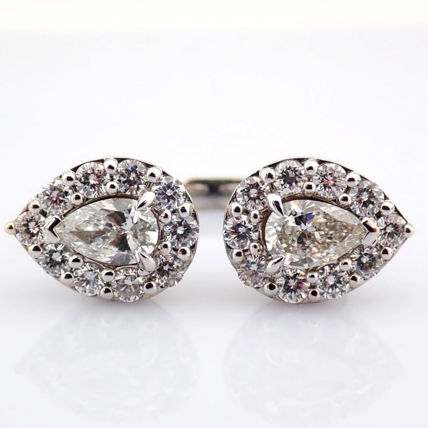 Pear Cut Lab-Grown Diamond Ring - 3.11 Total Carat (MDI Certified): Title: Pear Cut Lab-Grown Diamond Ring - 3.11 Total Carat (MDI Certified) Description: -------------------------------------------------- METALS AND WEIGHTS : -14K White Gold 7.95 gr