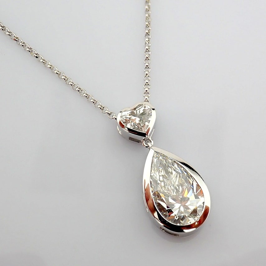 Pear Cut Lab-Grown Diamond Necklace - 3.48 Total Carat (IGI Certified): Title: Pear Cut Lab-Grown Diamond Necklace - 3.48 Total Carat (IGI Certified) Description: -------------------------------------------------- METALS AND WEIGHTS : -14K White Gold 5.57 gr