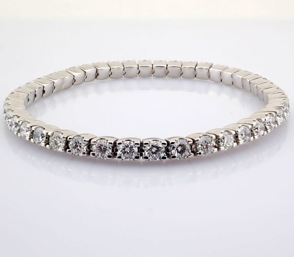 Round Cut Lab-Grown Diamond Tennis Bracelet - 4.85 Total Carat (MDI Certified): Title: Round Cut Lab-Grown Diamond Tennis Bracelet - 4.85 Total Carat (MDI Certified) Description: -------------------------------------------------- METALS AND WEIGHTS : -14K White Go