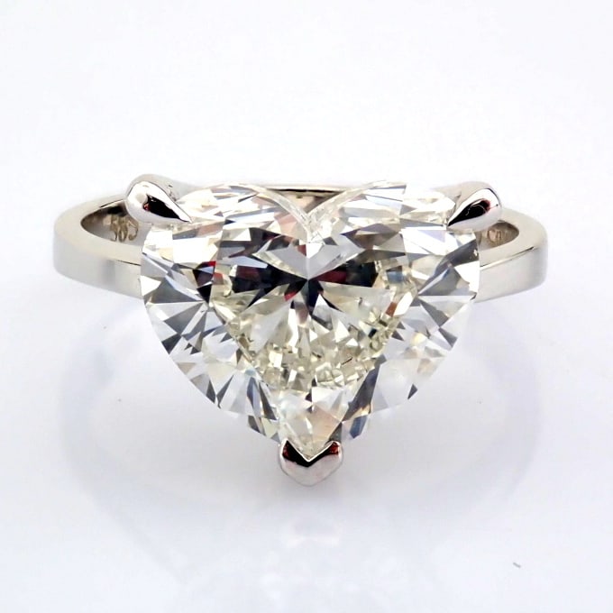 Heart Cut Lab-Grown Diamond Ring - 4.05 Total Carat (IGI Certified): Title: Heart Cut Lab-Grown Diamond Ring - 4.05 Total Carat (IGI Certified) Description: -------------------------------------------------- METALS AND WEIGHTS : -14K White Gold 3.99 gr