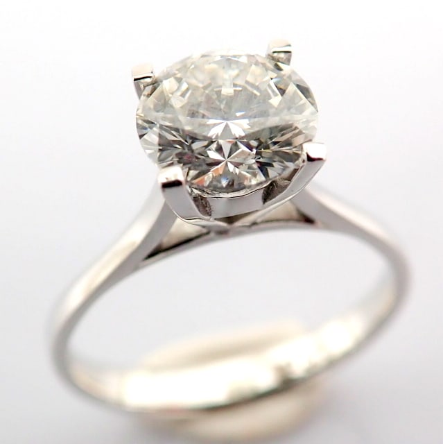 Round Cut Lab-Grown Diamond Ring - 1.17 Total Carat (IGI Certified): Title: Round Cut Lab-Grown Diamond Ring - 1.17 Total Carat (IGI Certified) Description: -------------------------------------------------- METALS AND WEIGHTS : -14K White Gold 2.36 gr<