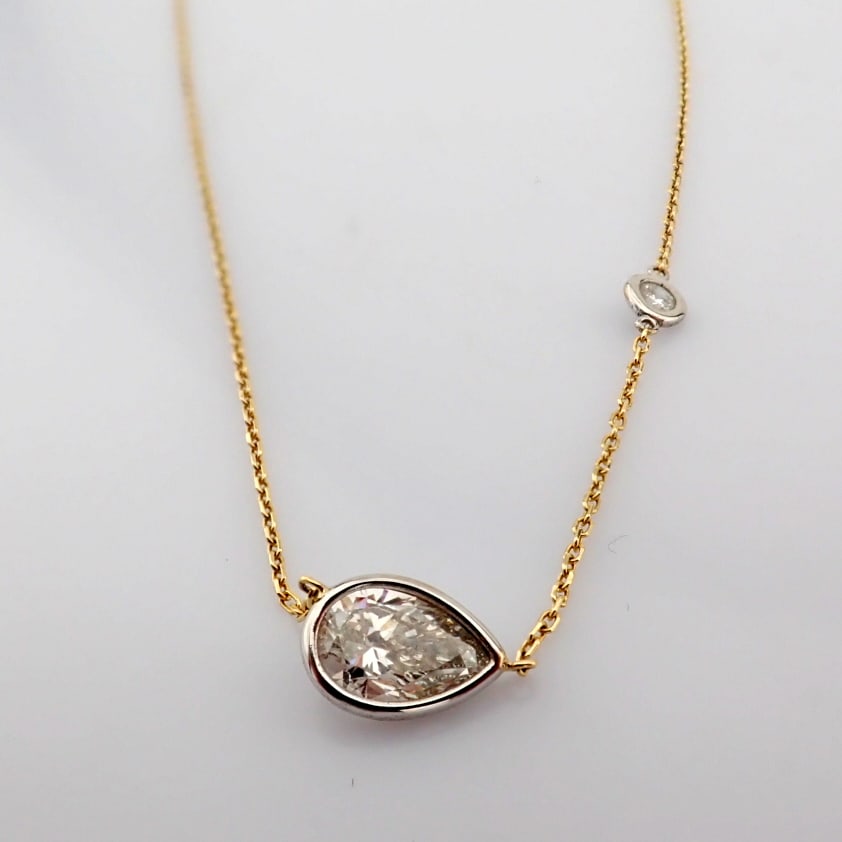 Pear Cut Lab-Grown Diamond Necklace - 1.07 Total Carat (IGI Certified): Title: Pear Cut Lab-Grown Diamond Necklace - 1.07 Total Carat (IGI Certified) Description: -------------------------------------------------- METALS AND WEIGHTS : -14K Yellow /White Gold 2.06 gr