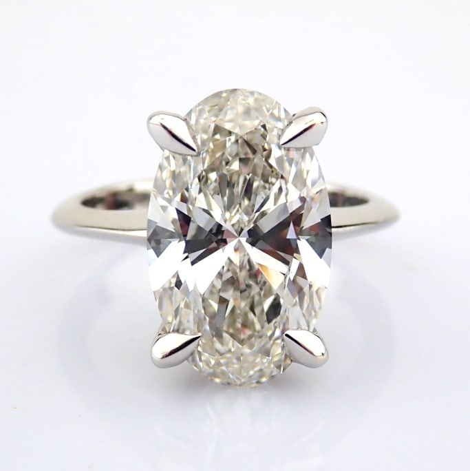 Oval Cut Lab-Grown Diamond Ring - 5.11 Total Carat (IGI Certified): Title: Oval Cut Lab-Grown Diamond Ring - 5.11 Total Carat (IGI Certified) Description: -------------------------------------------------- METALS AND WEIGHTS : -14K White Gold 4.77 gr