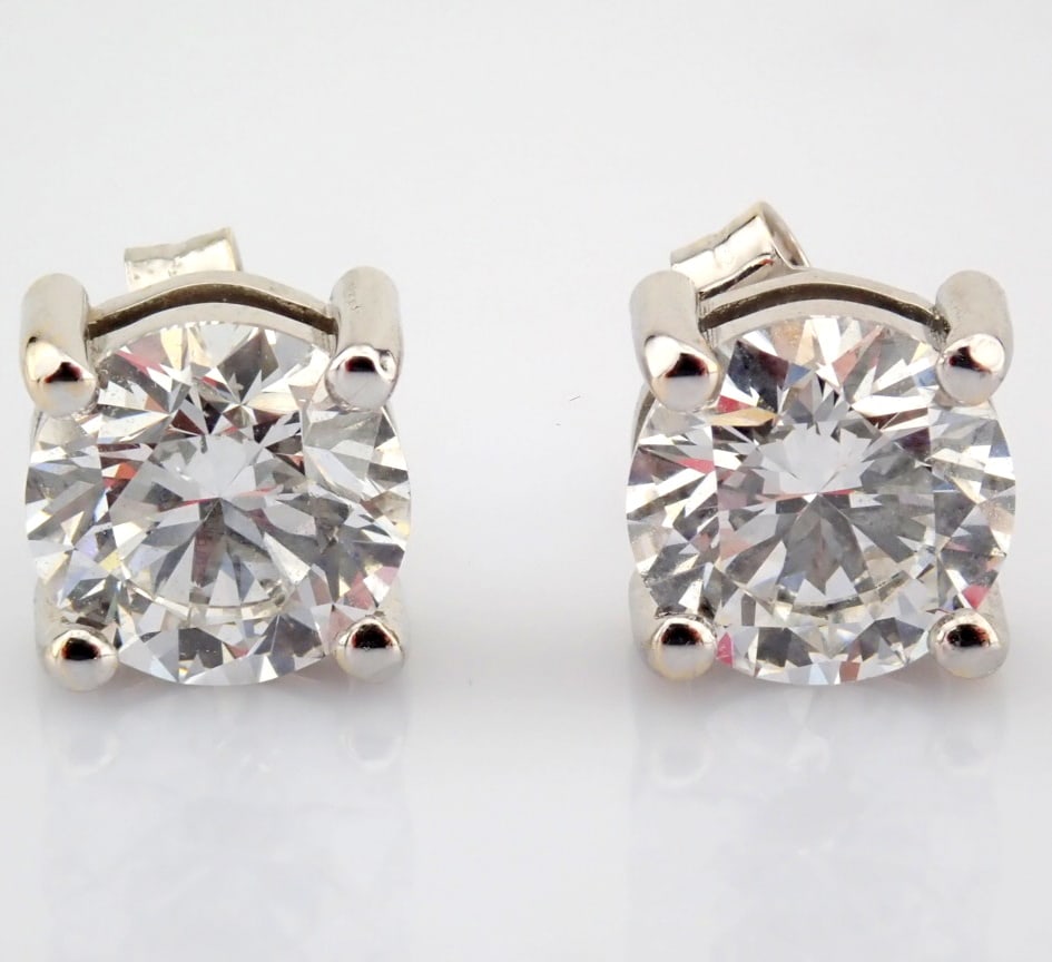 Round Cut Lab-Grown Diamond Earring - 2.9 Total Carat (IGI Certified): Title: Round Cut Lab-Grown Diamond Earring - 2.9 Total Carat (IGI Certified) Description: -------------------------------------------------- METALS AND WEIGHTS : -14K White Gold 2.4 gr