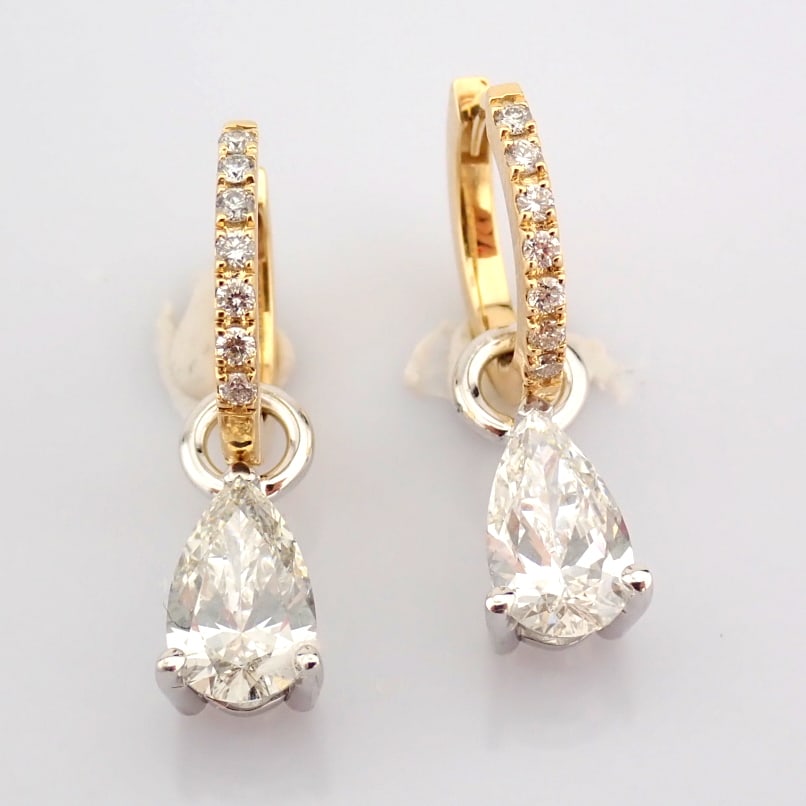 Pear Cut Lab-Grown Diamond Earring - 2.1 Total Carat (IGI Certified): Title: Pear Cut Lab-Grown Diamond Earring - 2.1 Total Carat (IGI Certified) Description: -------------------------------------------------- METALS AND WEIGHTS : -14K Yellow /White Gold 3.55 gr