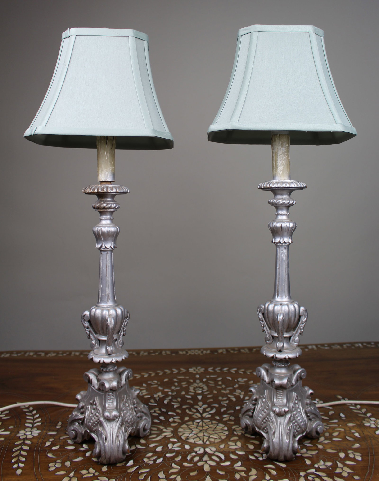 Pair of Silver Carved Table Lamps: Title: Pair of Silver Carved Table Lamps Description: Pair of Silver Carved Table Lamps. Height 73 cm. Condition: Used Delivery option: