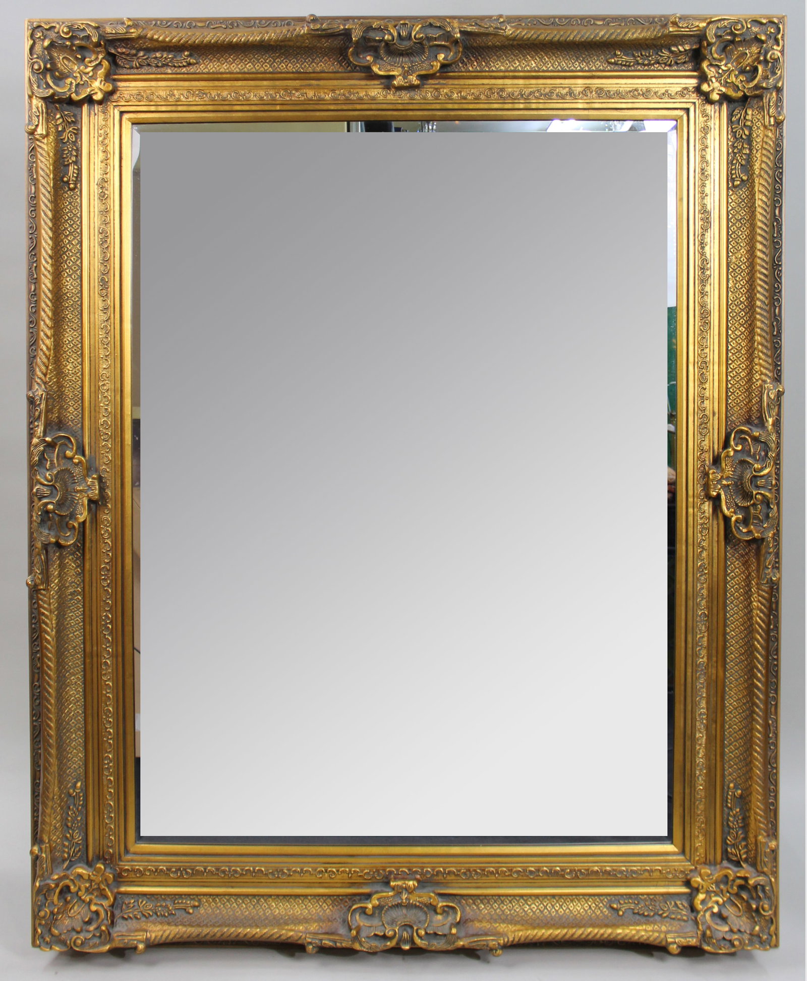 Large Ornate Gilt Bevelled Mirror 4 x 5 ft: Title: Large Ornate Gilt Bevelled Mirror 4 x 5 ft Description: Large Ornate Gilt Bevelled Mirror – 4 x 5 ft A handsome large wall mirror with an ornate gilt frame featuring classical moulded