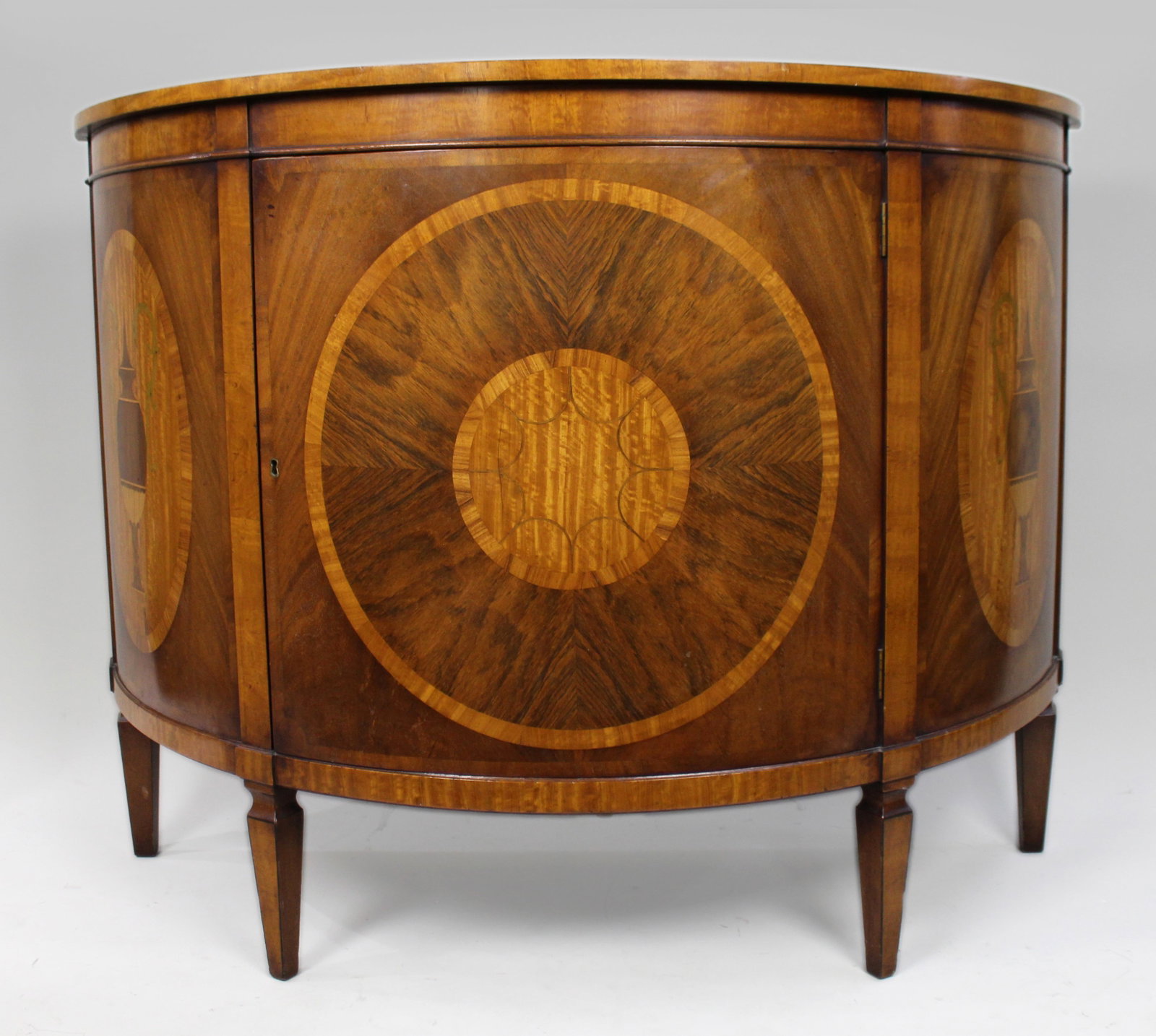 Elegant Neoclassical Style Inlaid Demilune Cabinet: Title: Elegant Neoclassical Style Inlaid Demilune Cabinet Description: Elegant Neoclassical Style Demilune Cabinet A fine quality demilune side cabinet in the neoclassical taste, beautifully veneered