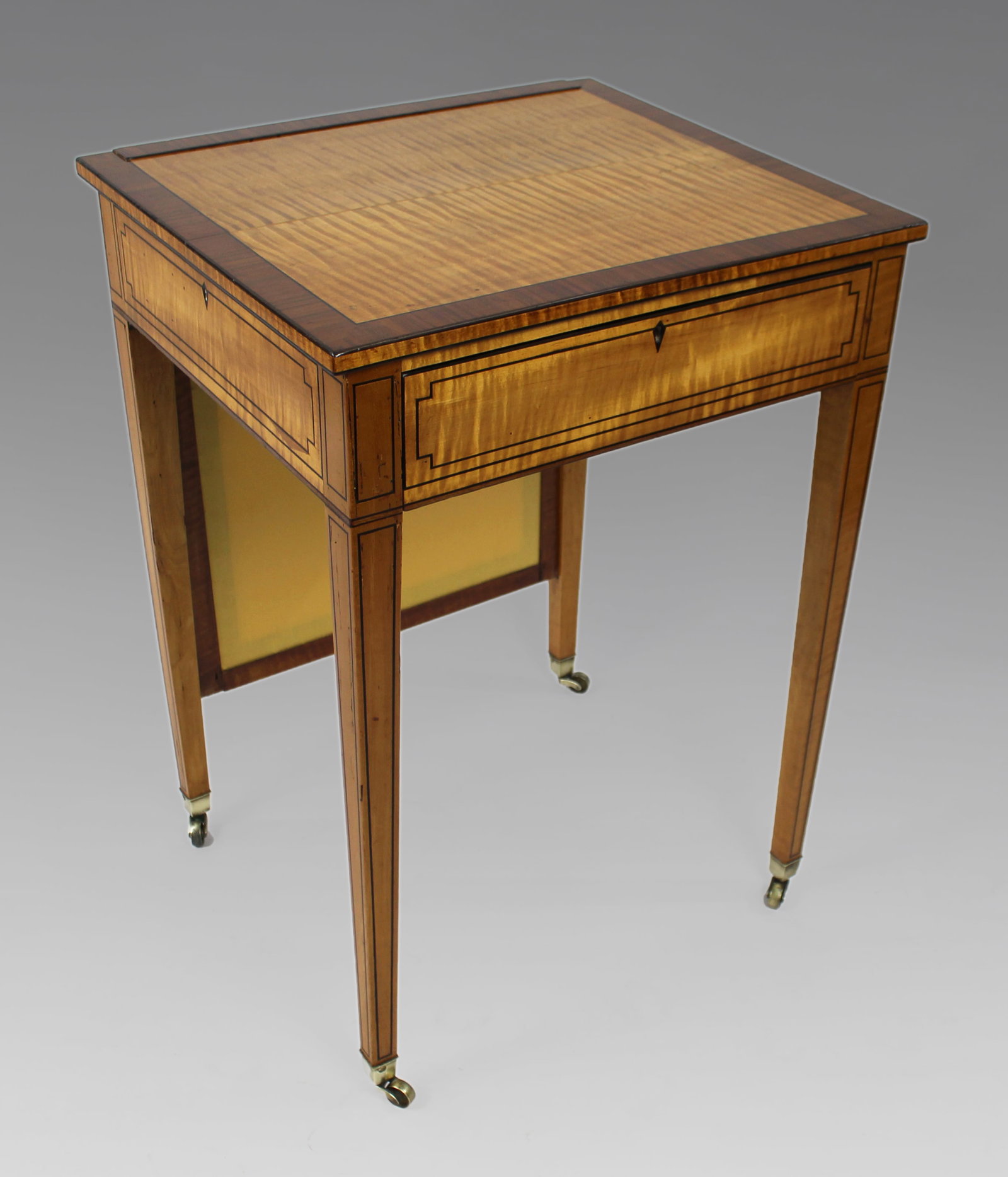 George III Sheraton Satinwood Writing Table: Title: George III Sheraton Satinwood Writing Table Description: George III Sheraton Satinwood Writing Table, c.1810 English – Early 19th Century A fine quality George III period satinwood