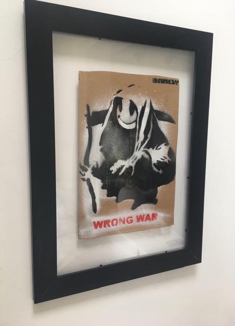 Banksy (b1974) ‘Wrong War’ & 6 Dismaland Bemusement Park Souvenirs Inc Framed Banksy Fre: Title: Banksy (b1974) ‘Wrong War’ & 6 Dismaland Bemusement Park Souvenirs Inc Framed Banksy Free Art, 2015 Description: Banksy (b1974) ‘WRONG WAR’ & Six Dismaland