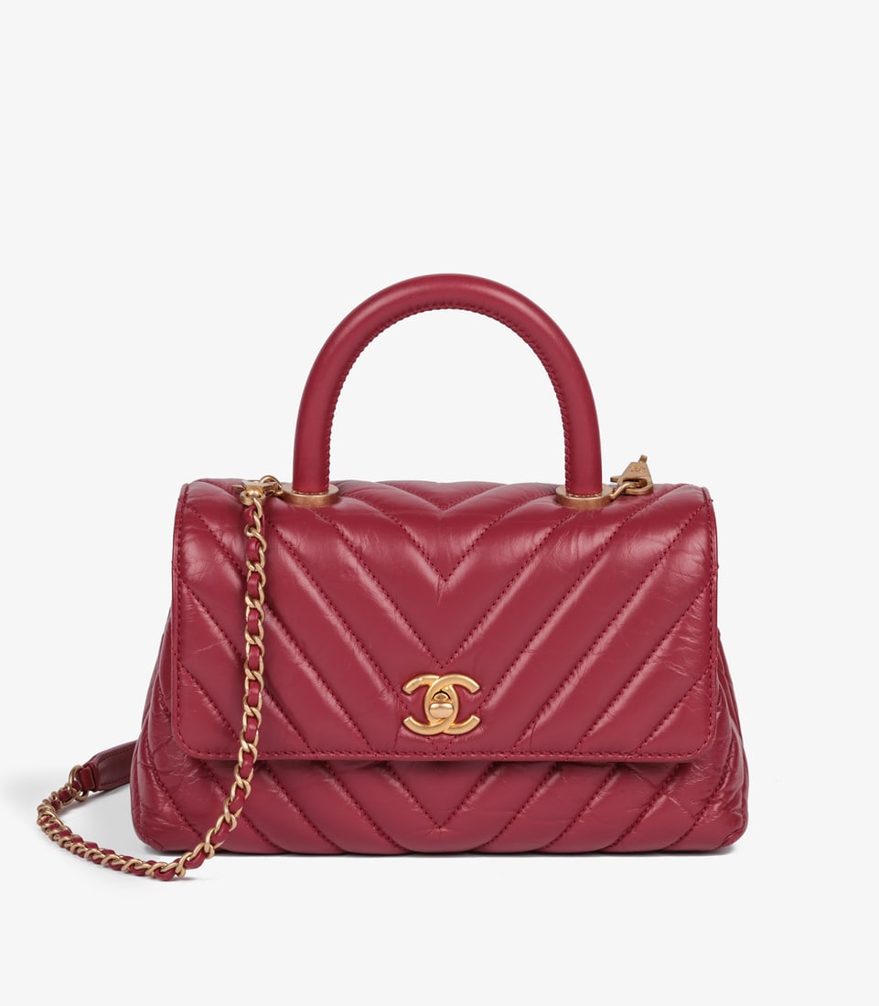 Chanel Red Chevron Aged Calfskin Leather Small Coco Top Handle: Title: Chanel Red Chevron Aged Calfskin Leather Small Coco Top Handle Description: Chanel Red Chevron Aged Calfskin Leather Small Coco Top Handle Product Details Ref: HB5169
