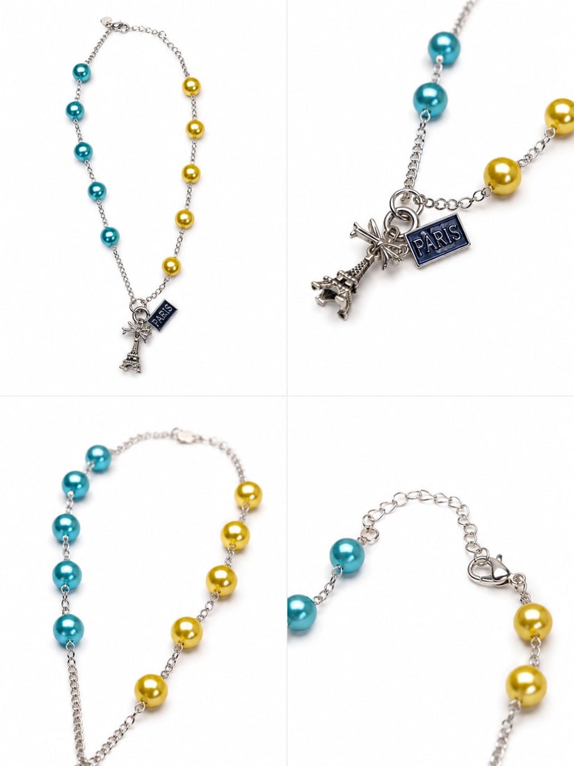 Paris Inspired Faux Pearl Necklace In Stainless Steel: Title: Paris Inspired Faux Pearl Necklace In Stainless Steel Description: Elegant stainless steel necklace featuring alternating turquoise-blue and golden faux pearls linked by a delicate