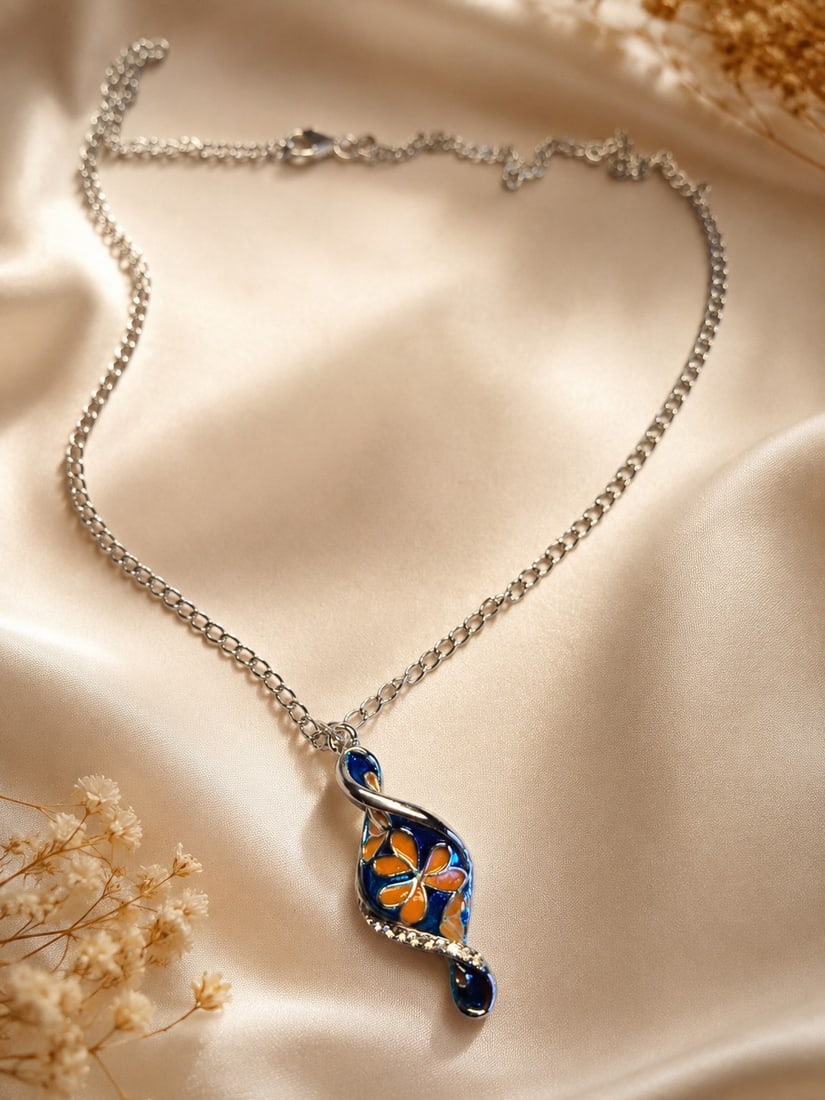 Stainless Steel Floral Enamel Pendant Necklace With 925 Silver Clasp: Title: Stainless Steel Floral Enamel Pendant Necklace With 925 Silver Clasp Description: Elegant stainless steel necklace featuring a beautifully crafted floral enamel pendant in vibrant blue and