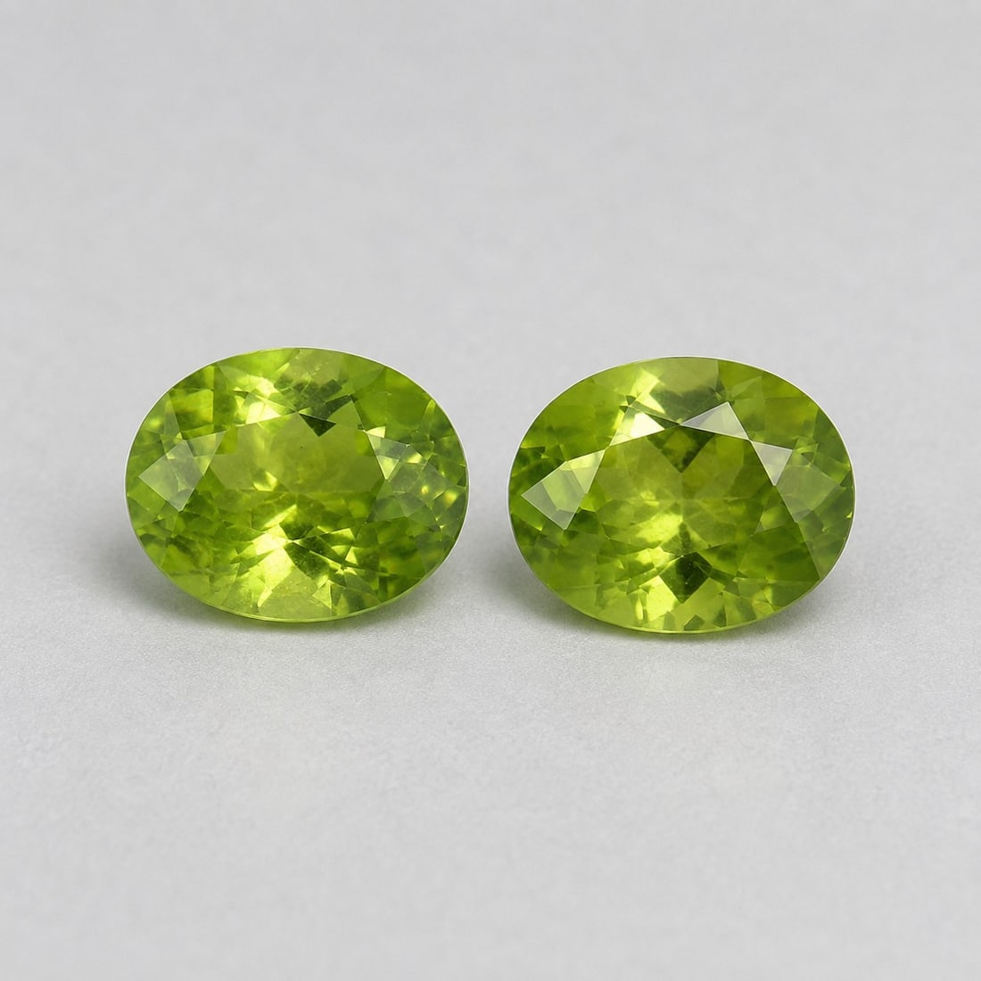 Natural Peridot Pair 7x5mm Oval Cut – Matching Gemstones: Title: Natural Peridot Pair 7x5mm Oval Cut – Matching Gemstones Description: Beautiful matching pair of natural peridot gemstones in an elegant oval cut, measuring 7x5 mm each. These