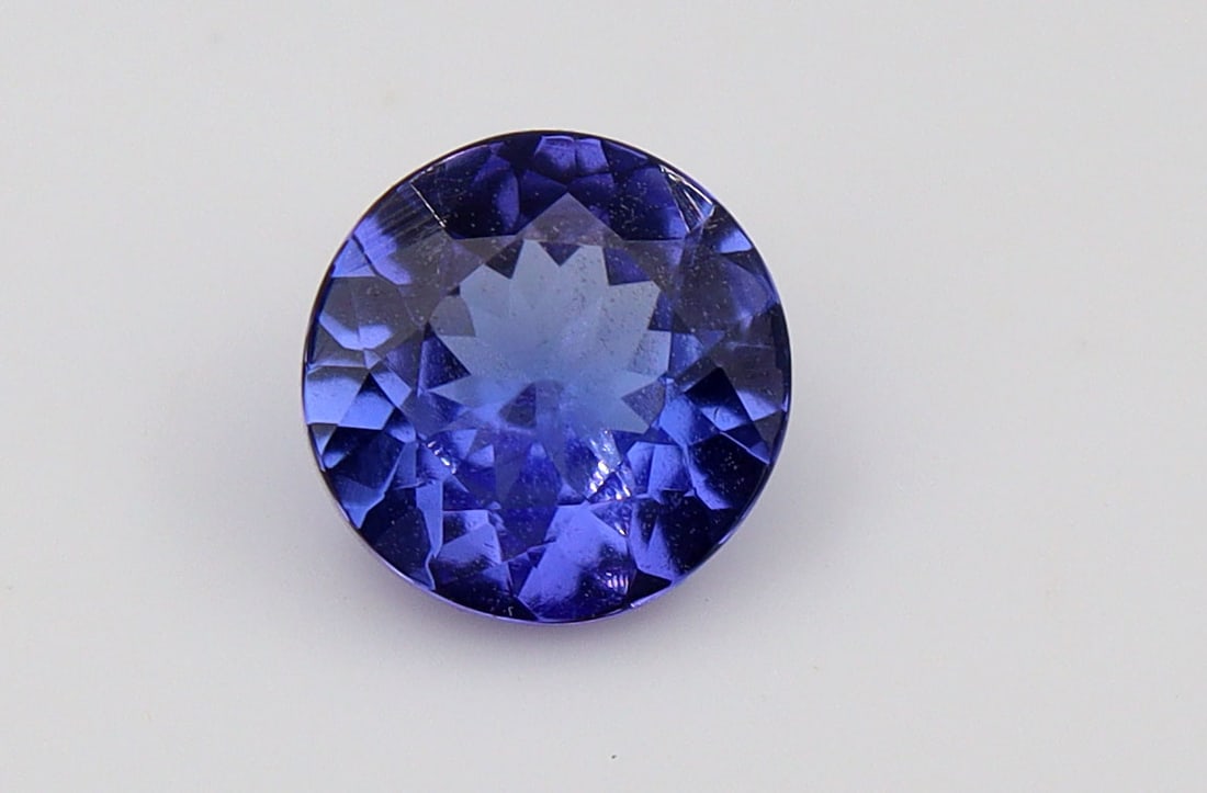 Tanzanite, 1.27 Ct: Title: Tanzanite, 1.27 Ct Description: Species: Zoisite Variety: Tanzanite Shape: Round Measurements: 6.91-7.03x3.82mm Colour: Violetish Blue Certificate: Yes (IGI/