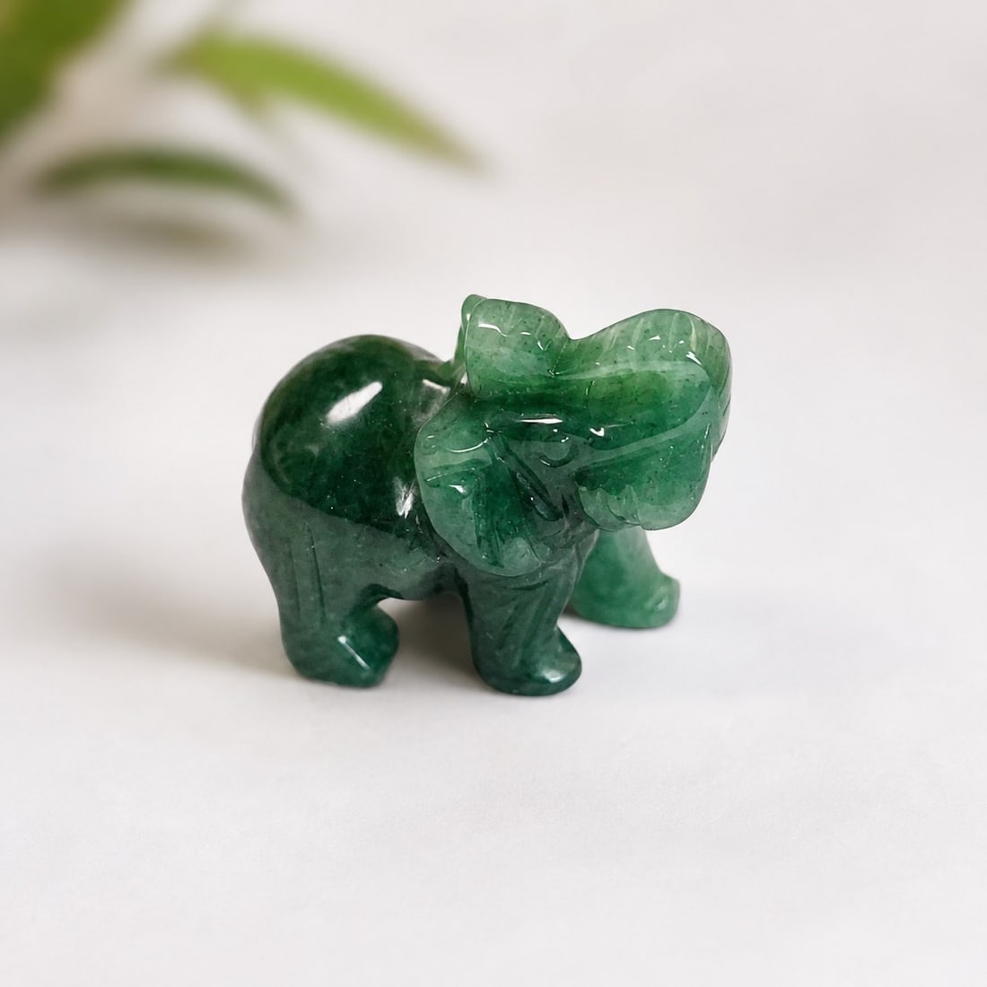 Green Aventurine Elephant Figurine – Hand Carved Natural Stone: Title: Green Aventurine Elephant Figurine – Hand Carved Natural Stone Description: Beautiful hand-carved elephant figurine crafted from natural green aventurine. The stone displays rich