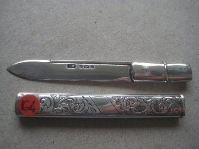 Rare Edwardian All Silver Pea Fruit Knife: Title: Rare Edwardian All Silver Pea Fruit Knife Description: Rare Edwardian All Silver Pea Fruit Knife. The handle is engraved with foliate decoration. The silver blade pulls out of the