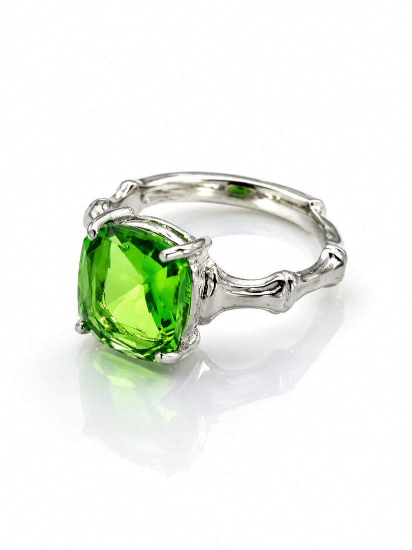 Silver Plated Ring With Cushion Cut Green Glass Gemstone – Adjustable Size: Title: Silver Plated Ring With Cushion Cut Green Glass Gemstone – Adjustable Size Description: Elegant silver-plated adjustable ring featuring a vibrant cushion-cut green glass gemstone. 