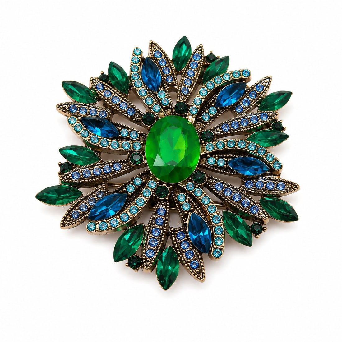 Vintage Green & Blue Crystal Statement Brooch – Gold Tone Floral Design: Title: Vintage Green & Blue Crystal Statement Brooch – Gold Tone Floral Design Description: Elegant vintage-style statement brooch featuring a brilliant oval green crystal centrepiece