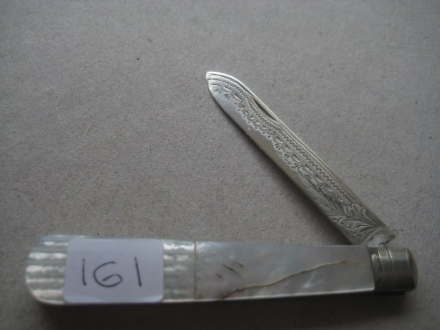 George V Mother of Pearl Hafted Silver Bladed Folding Fruit Knife: Title: George V Mother of Pearl Hafted Silver Bladed Folding Fruit Knife Description: George V Mother of Pearl Hafted Silver Bladed Folding Fruit Knife. The handle is engraved with Two