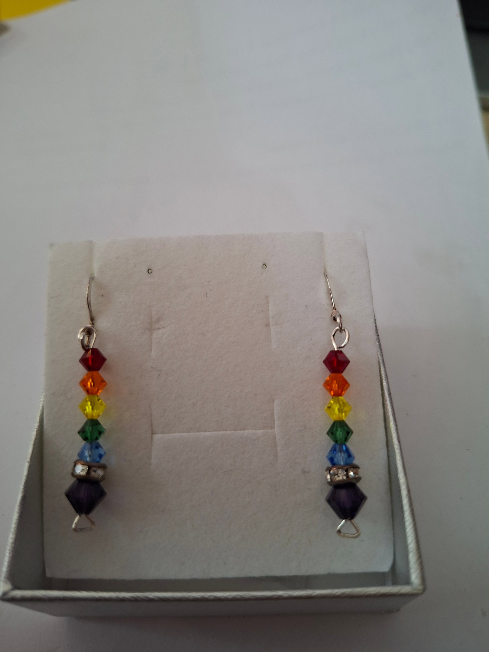 Gorgeous Multi Colour Earrings Handmade: Title: Gorgeous Multi Colour Earrings Handmade Description: Unworn handmade multi coloured drop earrings. Approx 3 cm drop Believed to be silver but no hallmark as handmade by a loca