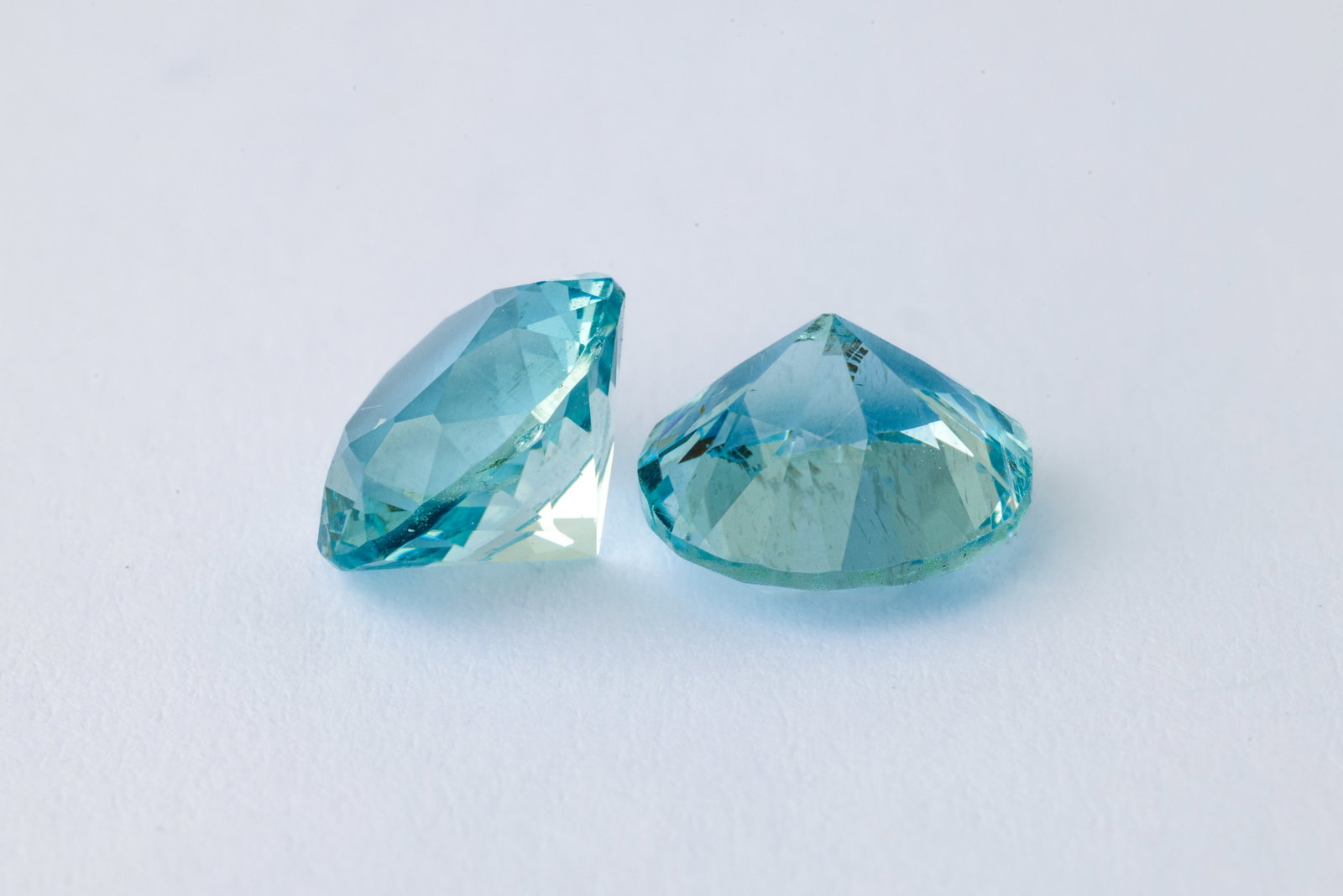 Aquamarines, 1.60 & 1.61Ct: Title: Aquamarines, 1.60 & 1.61Ct Description: Species: Beryl Variety: Aquamarine Shape: Round Brillant Cut Measurements: 7.8x5,15mm(2x) Colour: Blue Certificate: