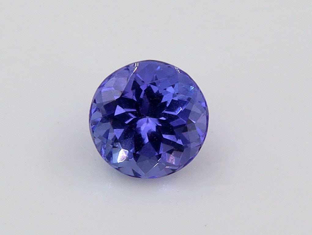 Tanzanite, 0.95 Ct: Title: Tanzanite, 0.95 Ct Description: Species: Zoisite Variety: Tanzanite Shape: Round Measurements: 5.88-5.88x4.20mm Colour: Violetish Blue Certificate: Yes (GSI/