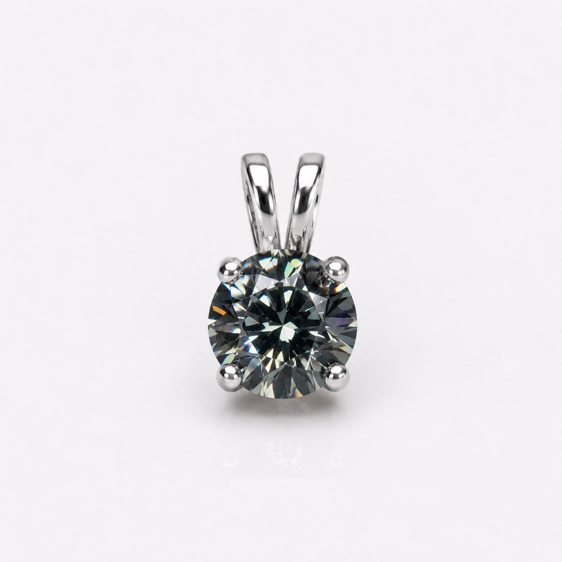 Certified 2 Ct Grey Moissanite Pendant In Sterling Silver 925: Title: Certified 2 Ct Grey Moissanite Pendant In Sterling Silver 925 Description: Elegant solitaire pendant featuring a stunning 2.00 carat round brilliant-cut grey moissanite, expertly set in