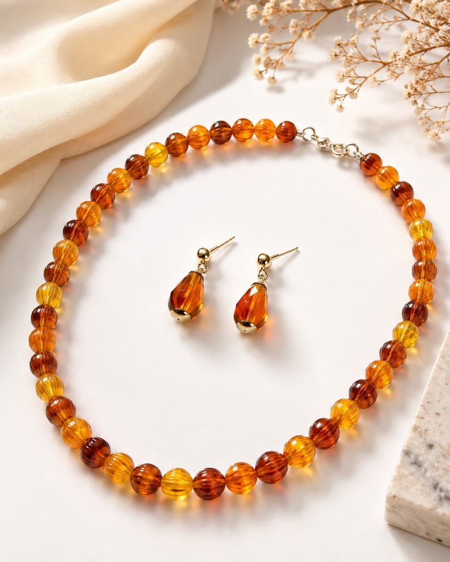 Amber-Tone Beaded Necklace & Matching Earrings Set: Title: Amber-Tone Beaded Necklace & Matching Earrings Set Description: Elegant jewellery set featuring a warm amber-toned beaded necklace with matching drop earrings. The graduated shades