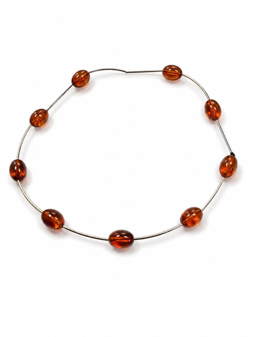 Natural Amber Bead Necklace On Stainless Steel Wire: Title: Natural Amber Bead Necklace On Stainless Steel Wire Description: Elegant necklace featuring genuine natural amber beads in rich cognac tones, beautifully arranged on a durable stainless stee