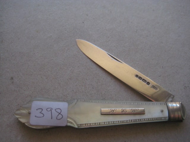 Victorian Mother of Pearl Hafted Silver Bladed Folding Fruit Knife: Title: Victorian Mother of Pearl Hafted Silver Bladed Folding Fruit Knife Description: Victorian Mother of Pearl Hafted Silver Bladed Folding Fruit Knife. The handle is carved, and
