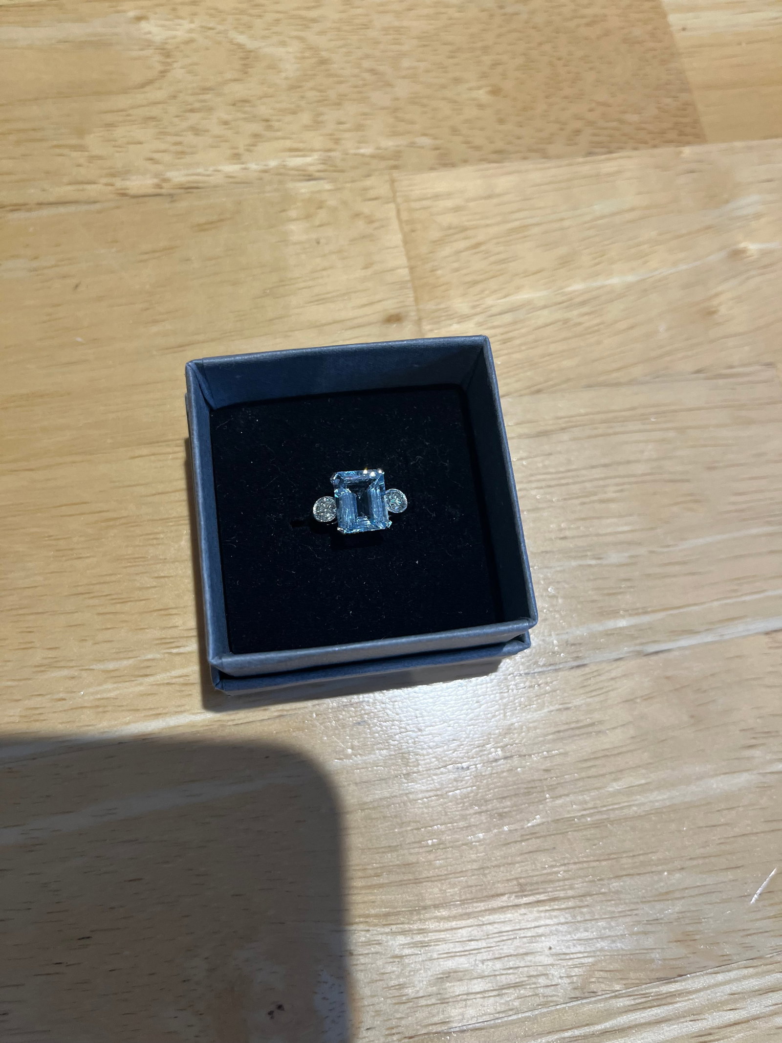 Platinum Aquamarine & Diamond Ring: Title: Platinum Aquamarine & Diamond Ring Description: A stunning platinum ring with a 2.8 carat central step cut aquamarine flanked by 2 round brilliant cut diamonds. Aquamarine 2.80 carat 