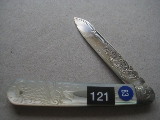 George V Mother of Pearl Hafted Silver Bladed Folding Fruit Knife: Title: George V Mother of Pearl Hafted Silver Bladed Folding Fruit Knife Description: George V Mother of Pearl Hafted Silver Bladed Folding Fruit Knife. The handle is decorated with a