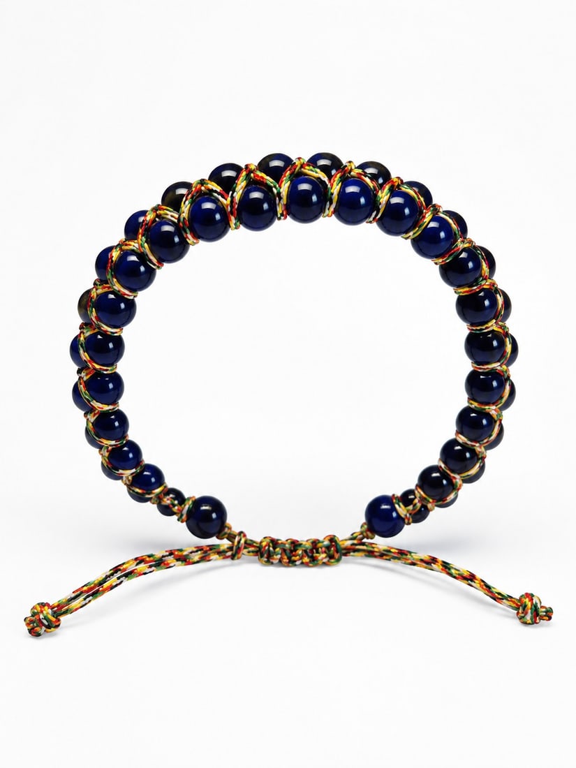 Adjustable Blue Bead Bracelet – Handcrafted Macramé Cord Design: Title: Adjustable Blue Bead Bracelet – Handcrafted Macramé Cord Design Description: Handcrafted adjustable bracelet featuring polished deep-blue beads woven into a colorful macramé