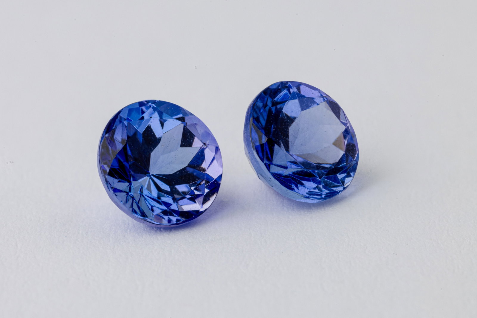 Tanzanite Pair, 1.05 & 1.06 Ct: Title: Tanzanite Pair, 1.05 & 1.06 Ct Description: Species: Zoisite Variety: Tanzanite Shape: Round Measurements: 6.05-6.02x4.43 & 6.03-6.00x4.30mm Colour: Violetish