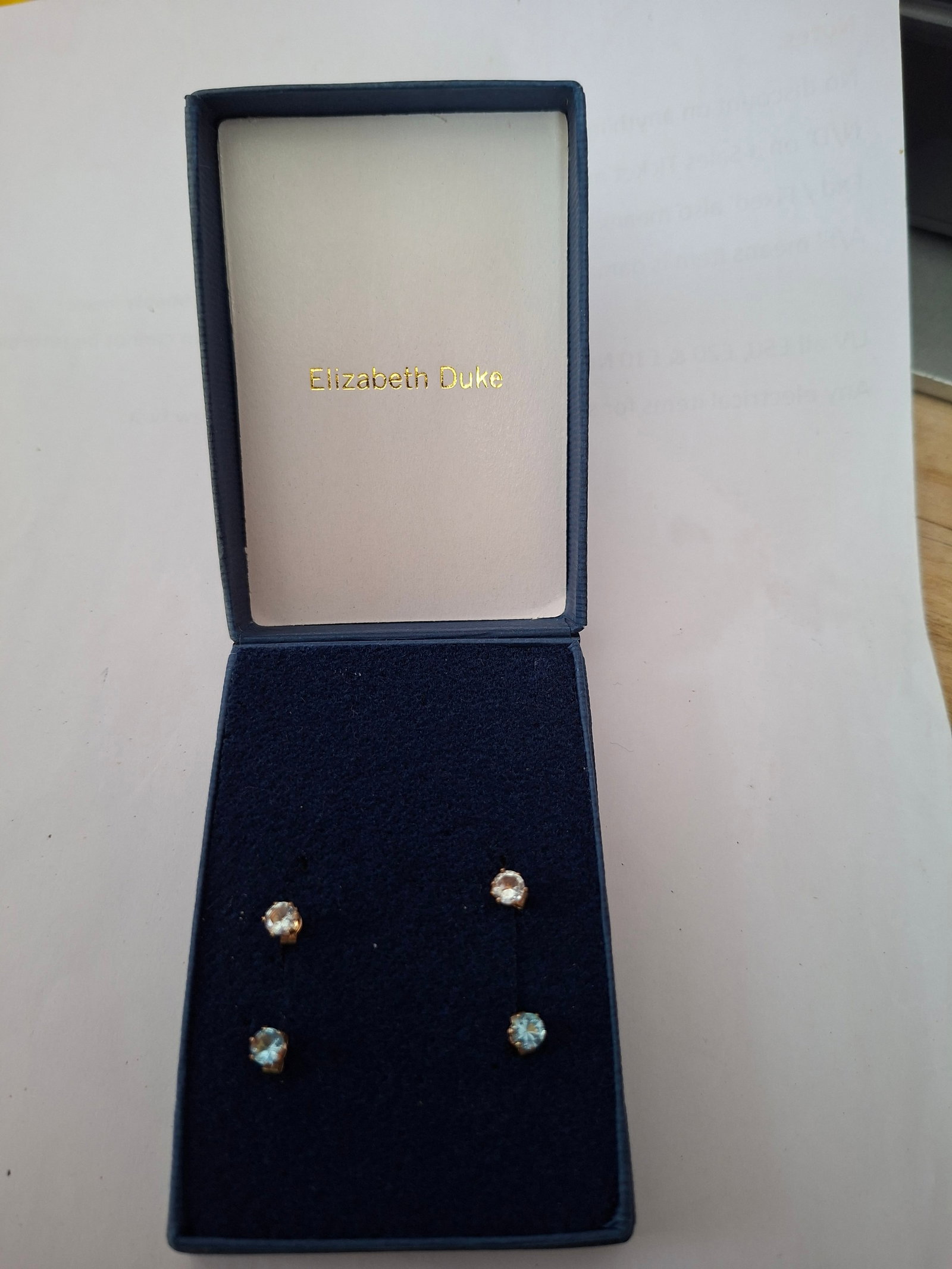 2 Pairs Gold Earrings With Pretty Stones: Title: 2 Pairs Gold Earrings With Pretty Stones Description: 2 pairs of pretty gold earrings. Stones are clear and blue. Design is Reflections from Elizabeth Duke. These have never been worn but have