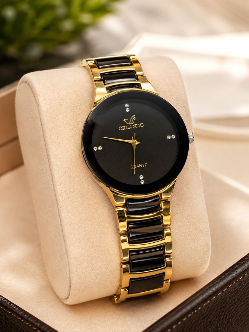 Orlando Gold & Black Quartz Watch – Elegant Modern Design: Title: Orlando Gold & Black Quartz Watch – Elegant Modern Design Description: Stylish Orlando quartz wristwatch featuring a striking black dial with gold-tone hands and crystal-style hour