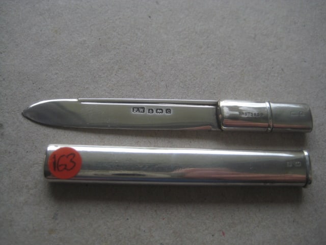 Rare Edwardian All Silver Pea Fruit Knife: Title: Rare Edwardian All Silver Pea Fruit Knife Description: Rare Edwardian All Silver Pea Fruit Knife. The handle is plain. The silver blade pulls out of the case. There is a registered
