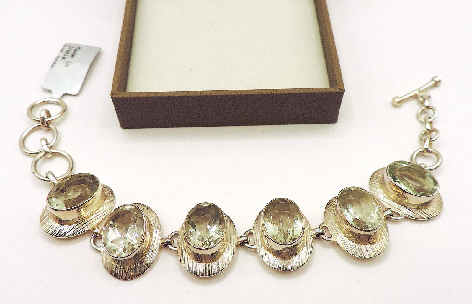 Sterling Silver 32 Carat Green Amethyst Bracelet Birmingham Hallmark: Title: Sterling Silver 32 Carat Green Amethyst Bracelet Birmingham Hallmark Description: A stunning bracelet in sterling silver set with 6 x 14 x 10mm oval Prasiolite (Green) Amethysts. T