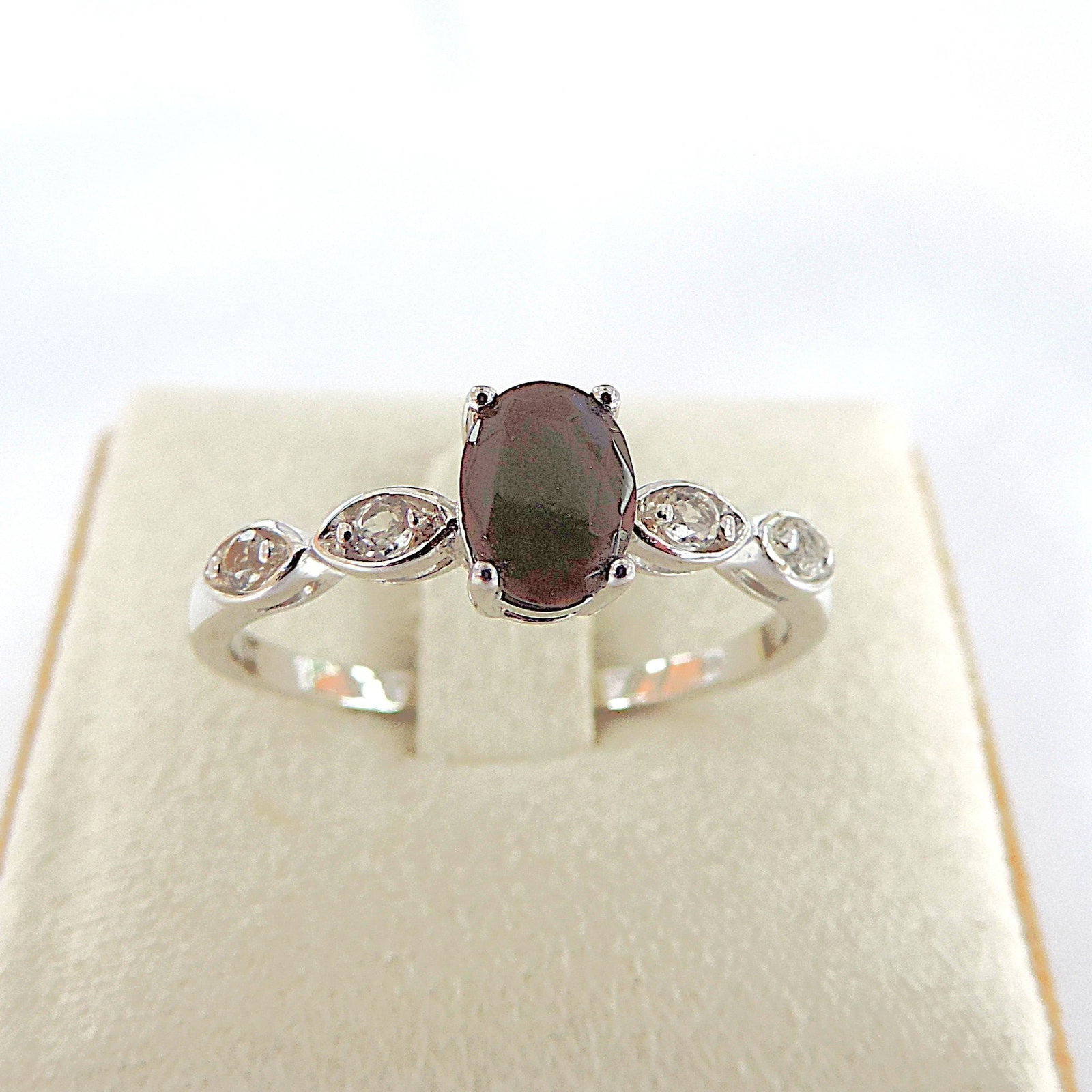 925 Silver Gemstone Ring 'New': Title: 925 Silver Gemstone Ring 'New' Description: A 925 silver ring set with a 6x4mm gemstone with white Topaz gemstones in the shoulders. Ring size U. New with gift pouch. Condition: